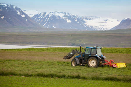 Landscape with tractor lake and mountains in North Iceland の写真素材