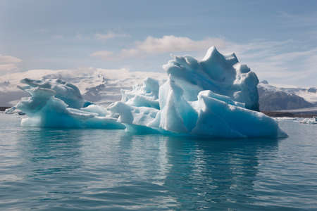 Icebergs floating and glacier in the background on Jokulsarlon Iceland Southeast area