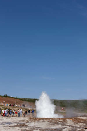 Geyser Strokkur against blue summer sky, erupting hot water and steam sequence 1 7  Icelandのeditorial素材