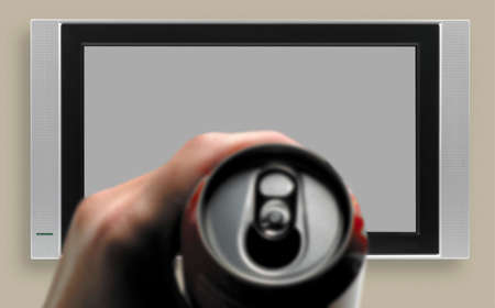 Man hand with refreshment can watching TV copy space