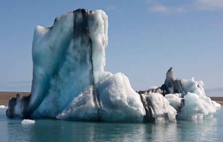 Icebergs floating and glacier in the background on Jokulsarlon Iceland Southeast area