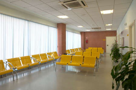 Hospital waiting area with yellow metallic chairs  Horizontal のeditorial素材