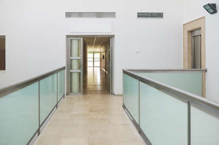 Modern building corridor with white walls  Horizontal