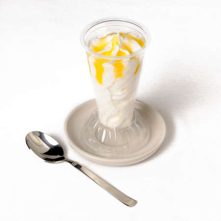 Ice cream with glass and spoon in a table  Horizontalの写真素材
