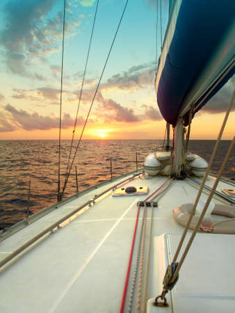 Sailing at sunset in the Mediterranean sea  Verticalの写真素材