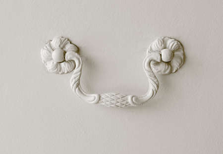 Detail of a drawer handle decorated on white  Horizontal                          の写真素材
