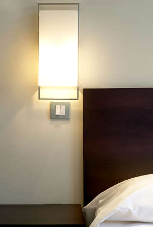 Hotel room detail with lamp and bed  Verticalのeditorial素材