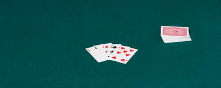 Complete card deck over a green table-hence  Horizontalの写真素材