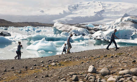 Icelandic landscape with tourists, lake and glacierのeditorial素材