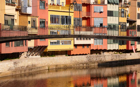 Colorful antique european facade and bridge  Girona  Spainの写真素材