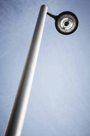Modern street lamp under a blue sky  Vertical formatの写真素材