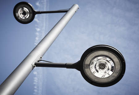 Modern street lamp under a blue sky  Vertical format