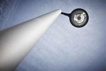 Modern street lamp under a blue sky  Vertical formatの写真素材