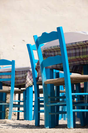 Traditional blue greek chairs in a taverna. Crete. Greeceの写真素材