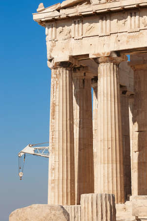 Acropolis of Athens. Parthenon columns and crane. Greece. Verticalの写真素材