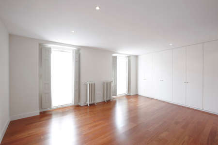 House empty room with classic iron heaters. Horizontal formatのeditorial素材