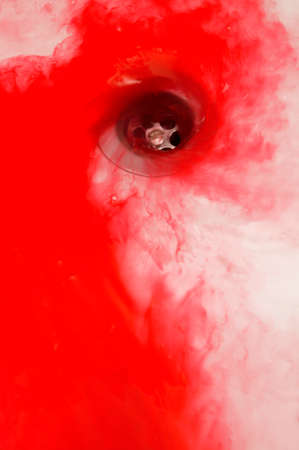 Tub drain with blood in vertical format. Red colorの写真素材