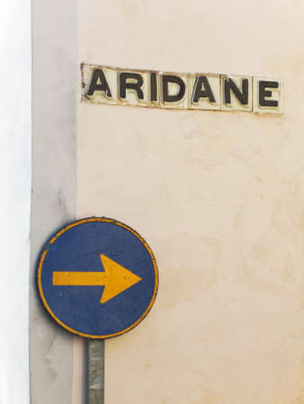 Rusty traffic one way signal and street name. Spain. La Palmaの写真素材