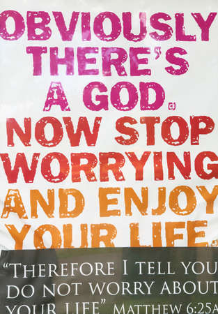 Religious advertising in a poster. Enjoy your life. Verticalの写真素材