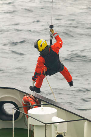 Coastguard rescue team in action. Scotland. UK. Vertical