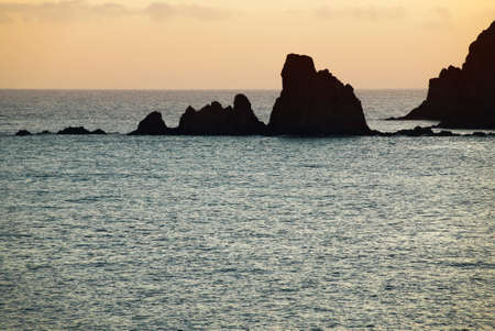 Rocky island in the mediterranean coastline at sunset, Almeria. Spain. Horizontalの写真素材
