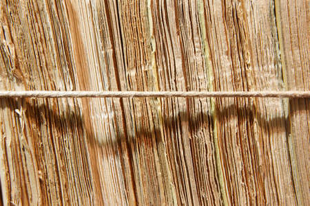 Antique documents wrapped with a string in warm tone. Horizontalの写真素材