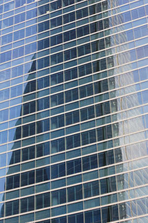 Skyscraper facade glass reflection in a financal area, Madrid. Verticalの写真素材