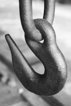 Iron hook detail in a chain. Black and white. Verticalの写真素材