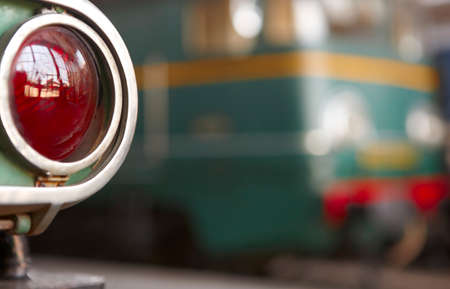 Railway station traffic red light and locomotive out of focus. Horizontalの写真素材