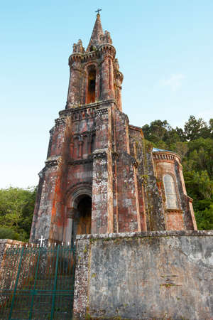 Neogothic chapel in Furnas lake. Sao Miguel. Portugal. Verticalの写真素材
