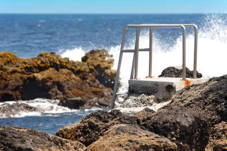 Rocky pool beach with stairs in Biscoitos. Terceira island. Azores. Portugalの写真素材