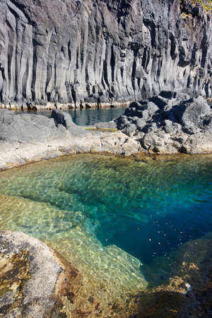 Azores basalt coastline in Sao Jorge. Faja do Ouvidor. Portugal. Verticalの写真素材