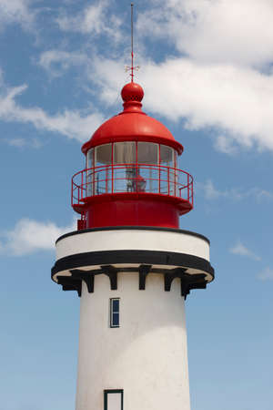 Red and white lighthouse in Topo, Sao Jorge, Azores. Portugal. Verticalの写真素材
