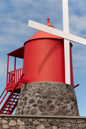 Traditional red and white windmill in Pico island, Azores. Portugal. Verticalの写真素材