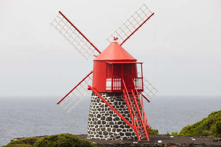 Traditional red and white windmill in Pico island, Azores. Portugal. Horizontalの写真素材