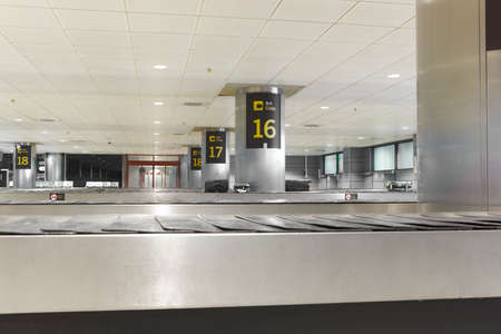 Baggage claim belts area in a modern airport. Nobody. Indoor Horizontal