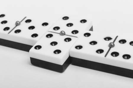 Domino game with pieces over a white background. Black, white. Detailの写真素材