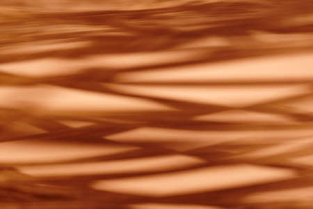 Warm tone abstract metallic background. Defocused. Horizontal formatの写真素材
