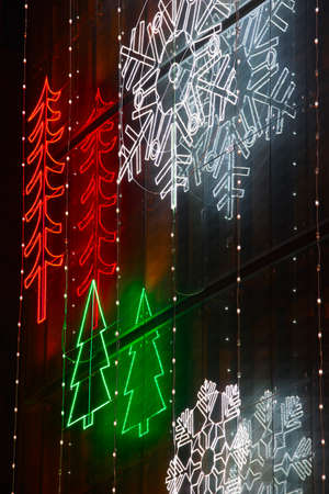Christmas lights decoration on a building facade. Vertical