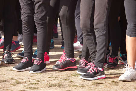 Young female athletic runners detail ready to run. Start zone. Horizontal formatの写真素材