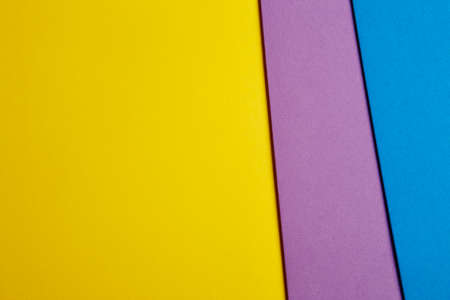 Colored cardboards background in blue purple yellow tone. Copy space. Horizontalの写真素材