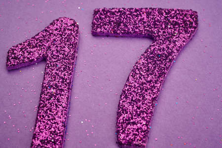 Number seventeen purple color over a purple background. Anniversary. Horizontal