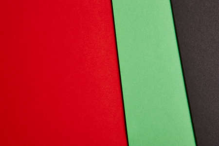 Colored cardboards background in red, green, black tone. Copy space. Horizontalの写真素材