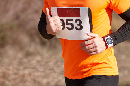 Male athletic runner on a cross country race. Outdoor circuit. Horizontalの写真素材