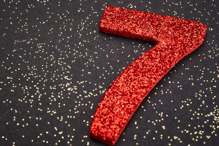 Number seven red color over a black background. Anniversary. Horizontalの写真素材