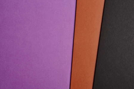 Colored cardboards background in purple brown black tone. Copy space. Horizontal