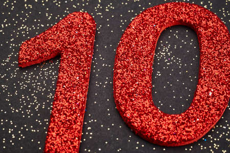 Number ten red color over a black background. Anniversary. Horizontalの写真素材