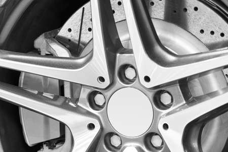 Sport vehicle disc brake and alloy wheels detail. Horizontal