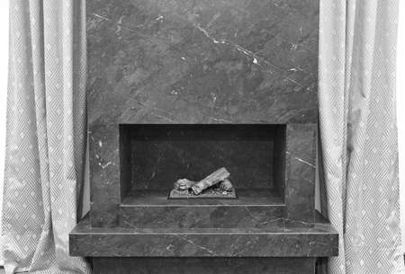 Minimalism stone fireplace. Apartment interior detail. Black whiteの写真素材