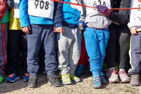 Children athletics runner on a cross country race. Start. Horizontalの写真素材